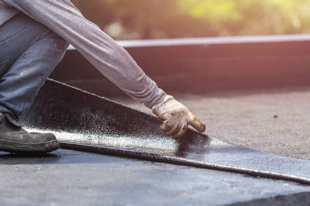 Professional Basement Waterproofing technician working in Hillsboro, KS